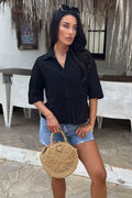 Camisa oversize de bordado inglés y manga corta en negro