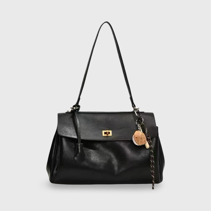 Bolso con cierre giratorio y colgante