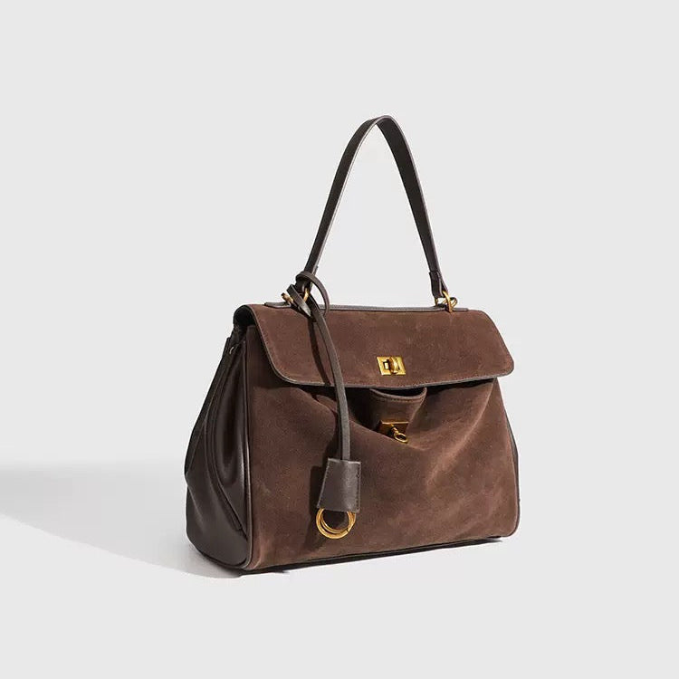 Bolso de piel y ante con herrajes dorados