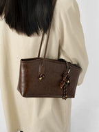 Bolso estructurado con asas largas