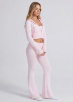 Conjunto de punto con chaqueta y pantalón acampanado